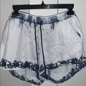 White distressed shorts